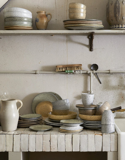 vintage style kitchen with gradient stoneware plates, bowls and mugs
