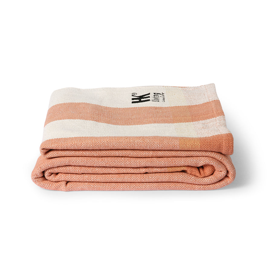 folded peach and cream striped cotton large beach blanket