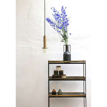 nordic interior with open shelf unit black vase with two handles on top with purple flowers