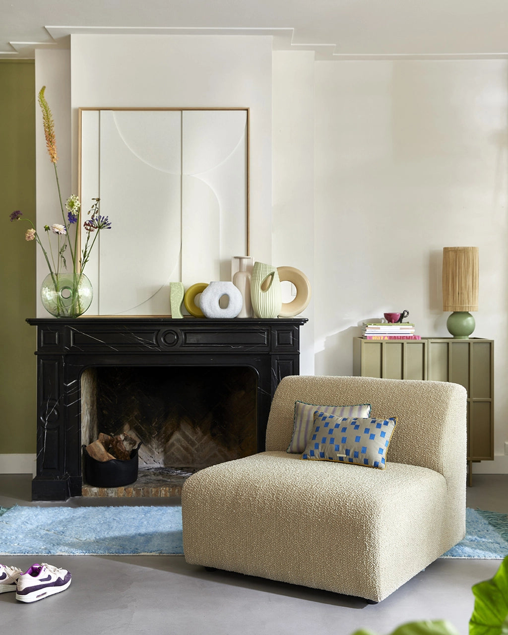modern style living room with fire place styled with flower vases in different shapes and colors