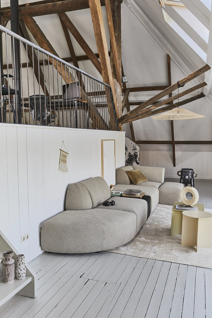 hand woven large triangle shape pendant light in a loft hanging from ceiling