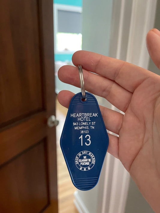 blue plastic classic motel key FOB with heartbreak hotel and room number 13