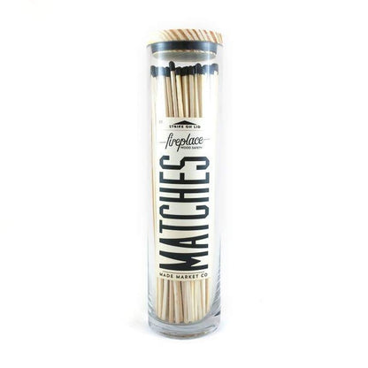 black tall matches in a glass jar with vintage label 