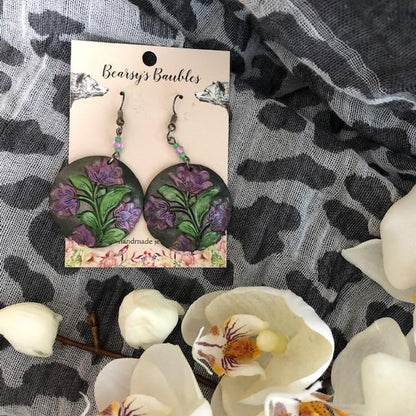 artsy earrings with green and purple metallic paint 