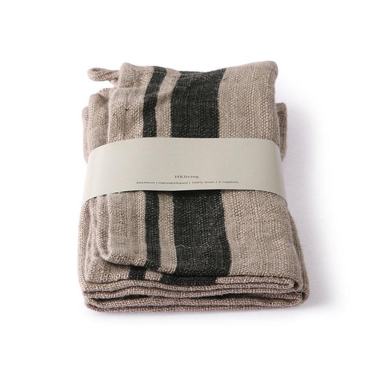 2 linen napkins in grey with charcoal colored striped folded in paper wrap