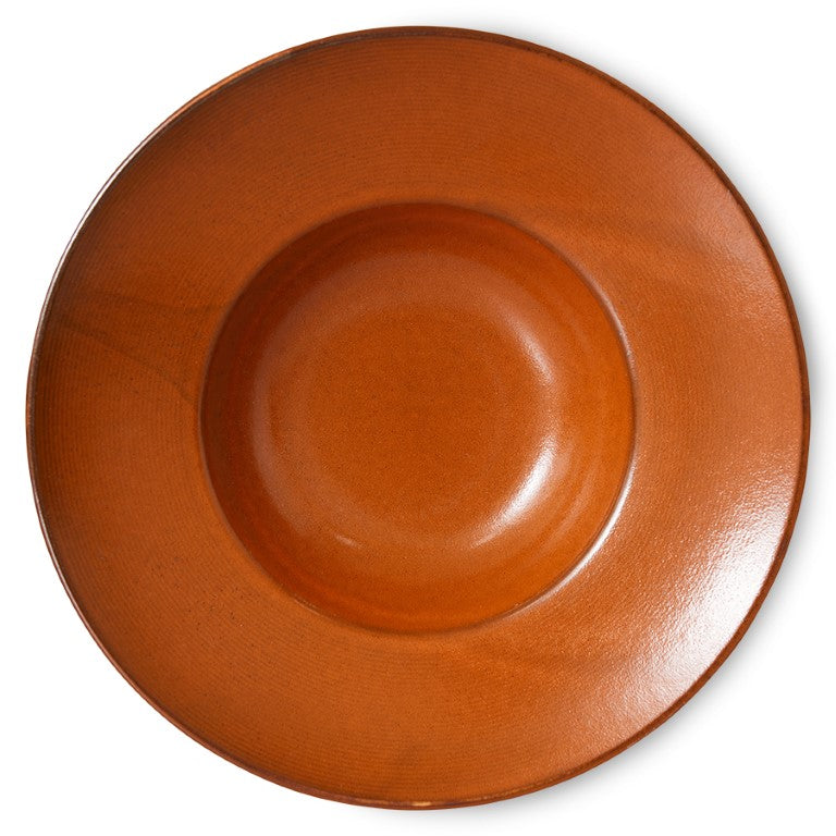 deep burned orange pasta plate made from porcelain