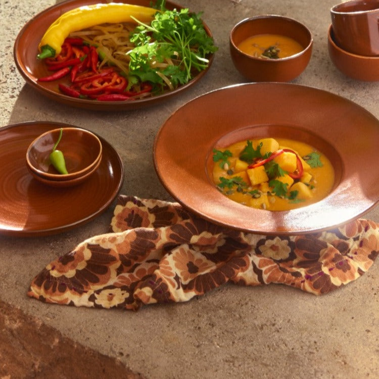 large pasta plate with pumpkin soup