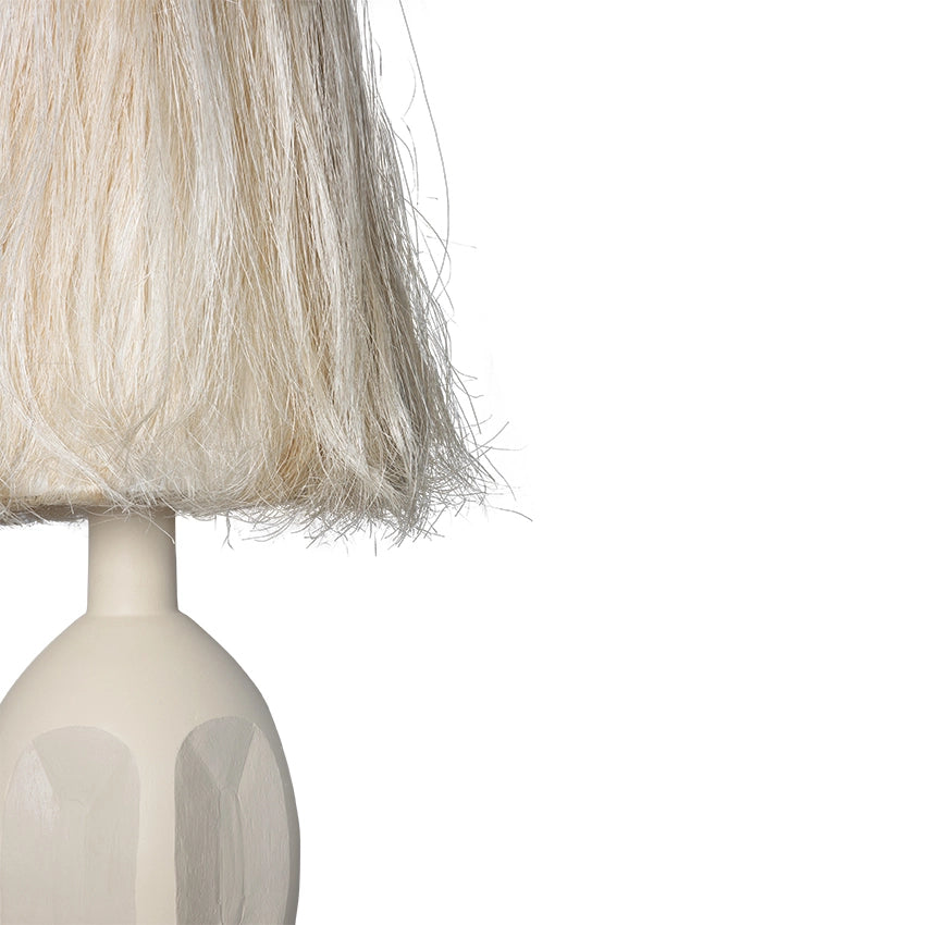 tall sand colored table lamp with stoneware base and abaca fiber shade