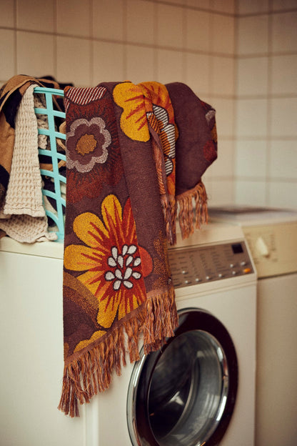 retro style large beach towel with flower design in laundry room