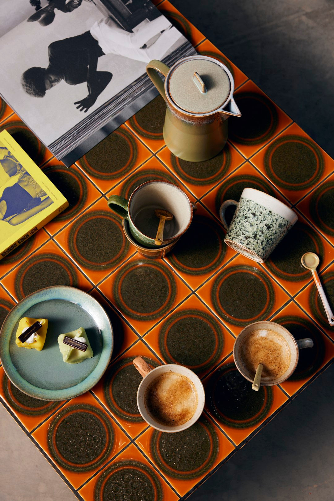 retro style table orange and brown with cappuccino mugs