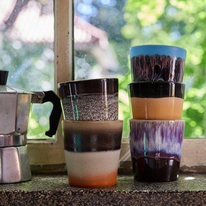 multi colored coffee tumbler cups stacked