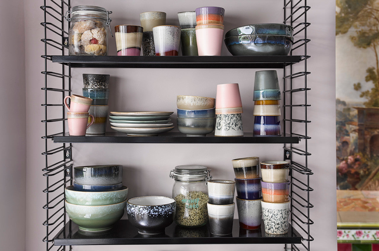 retro style mugs, tumblers and bowls in open shelving rack