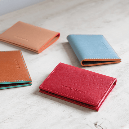 small wallets in red orange and blue