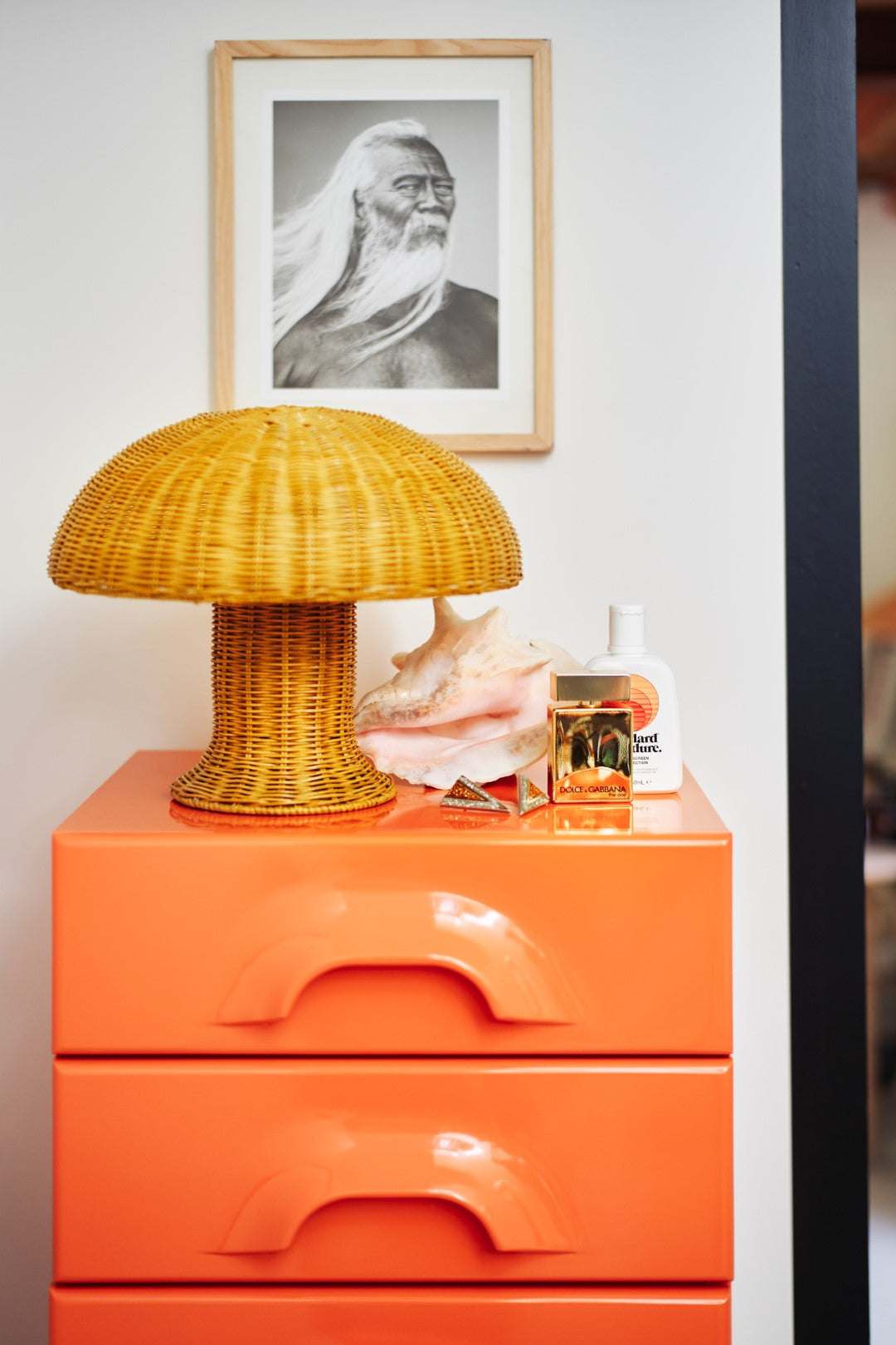 yellow rattan  rattan mushroom lamp on orange drawer