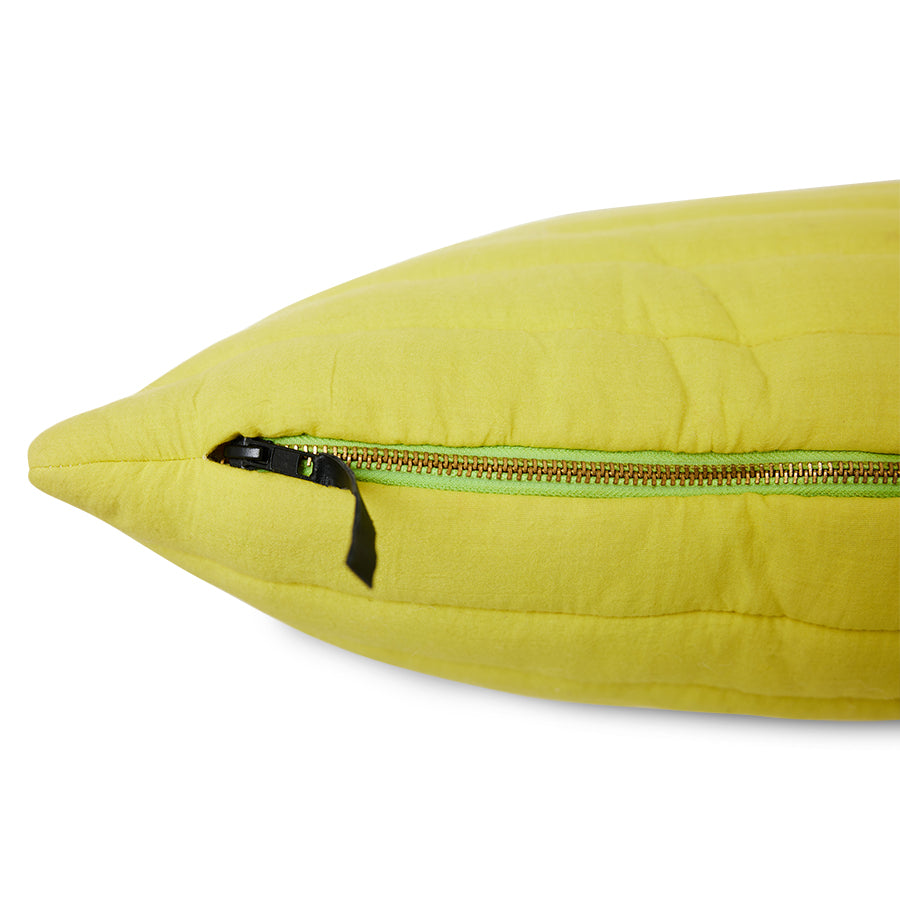 detail of green trim and zipper in bright yellow throw pillow