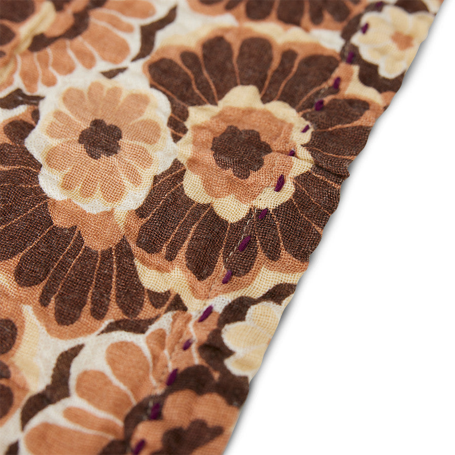 detail of cotton napkins with brown vintage flowers design