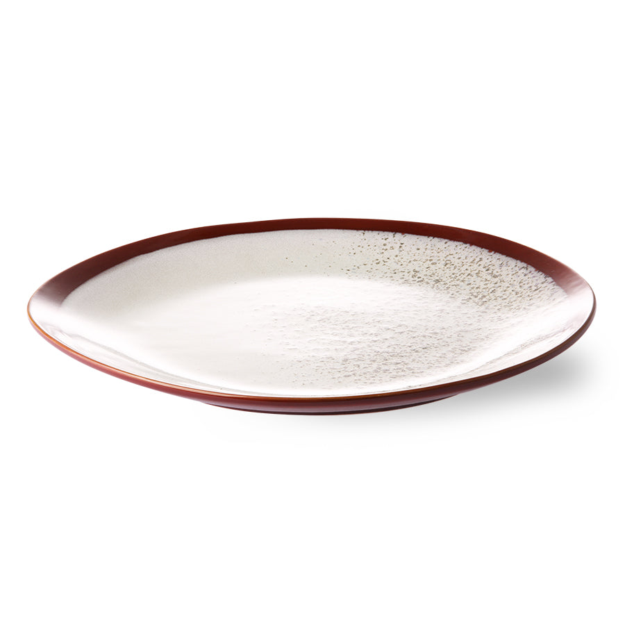 organic shape dinner plate with snow like pattern and brown red trim