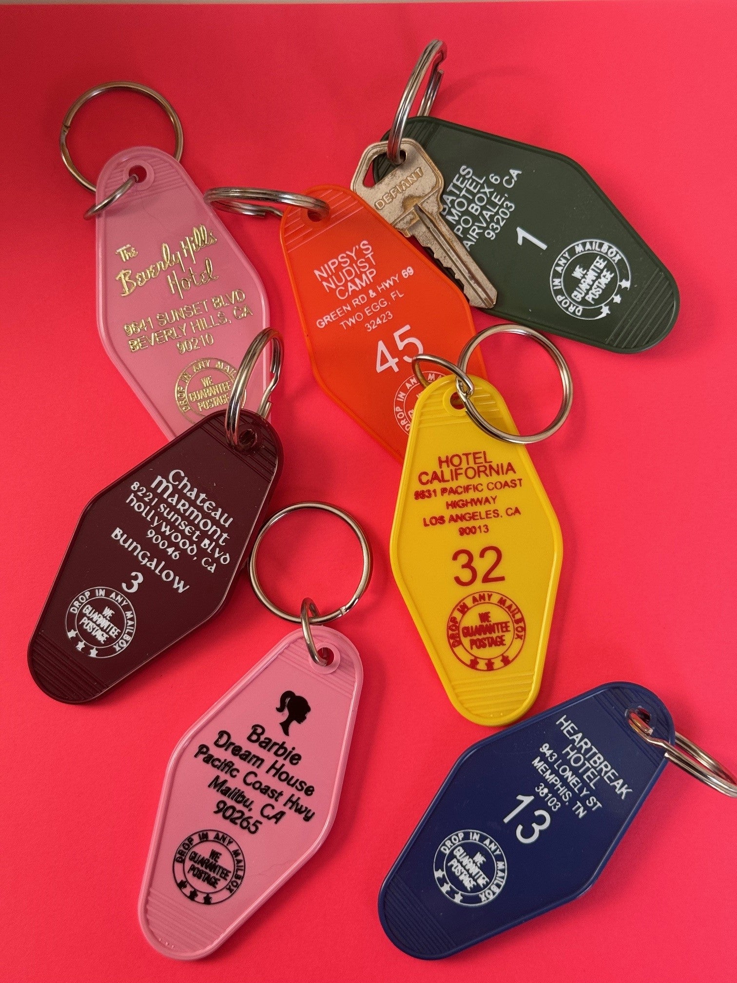 plastic motel key fob in green orange yellow blue and pink