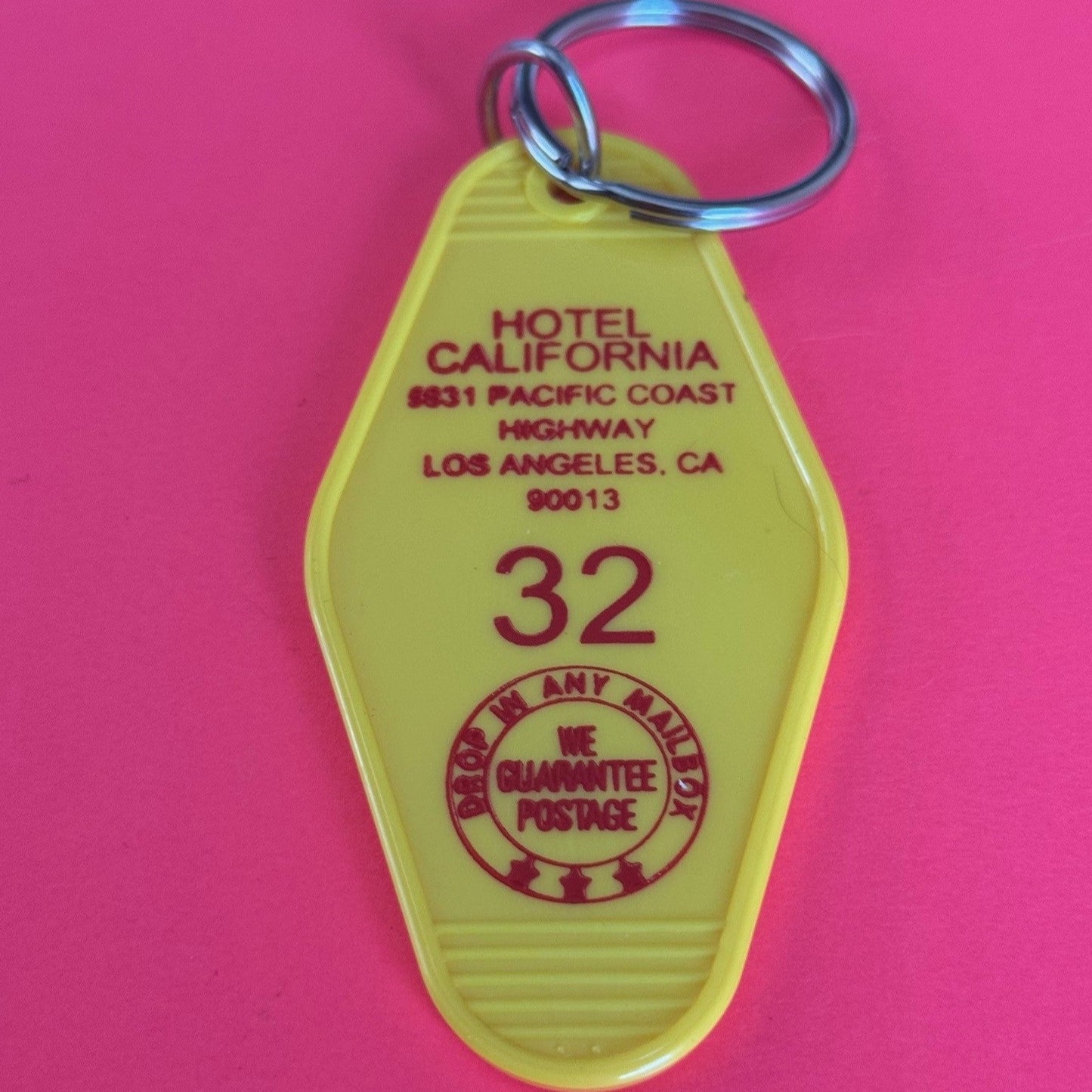 yellow key fob with hotel California address