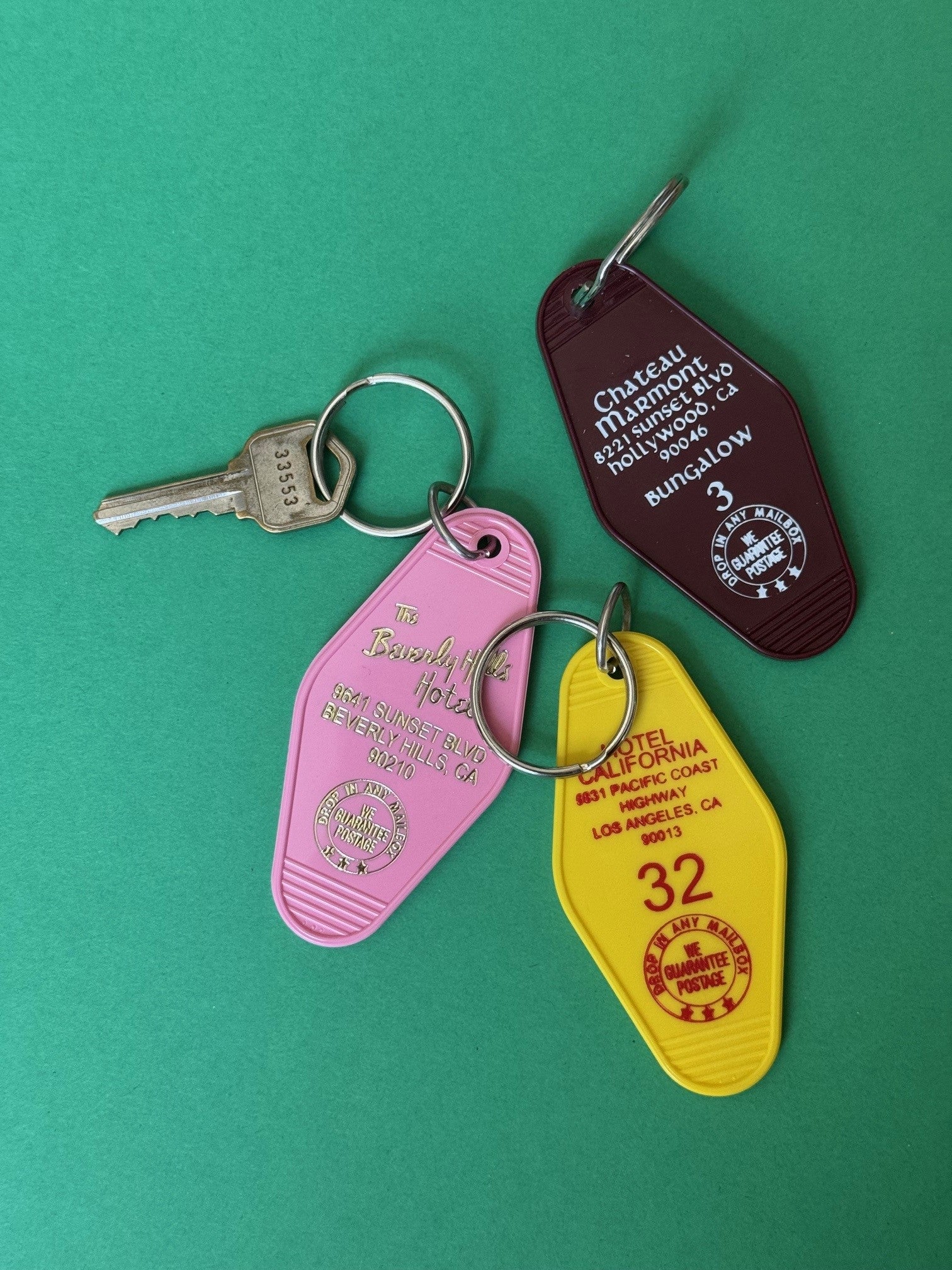pink yellow and maroon key bobs with hotel addressed