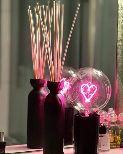 portable black aluminum base with large lightbulb with red heart