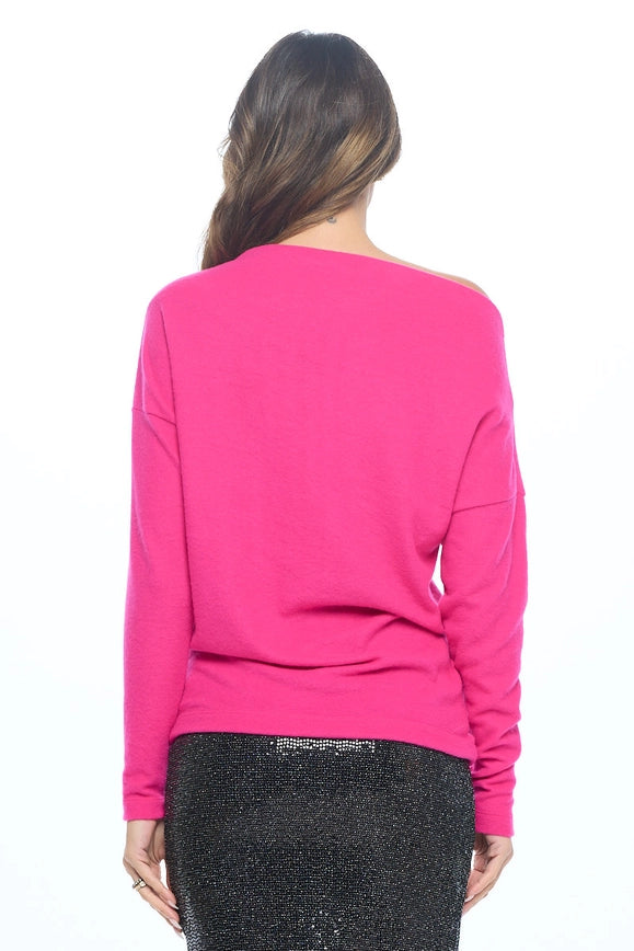 woman wearing pink off shoulder knit top on black glitter skirt