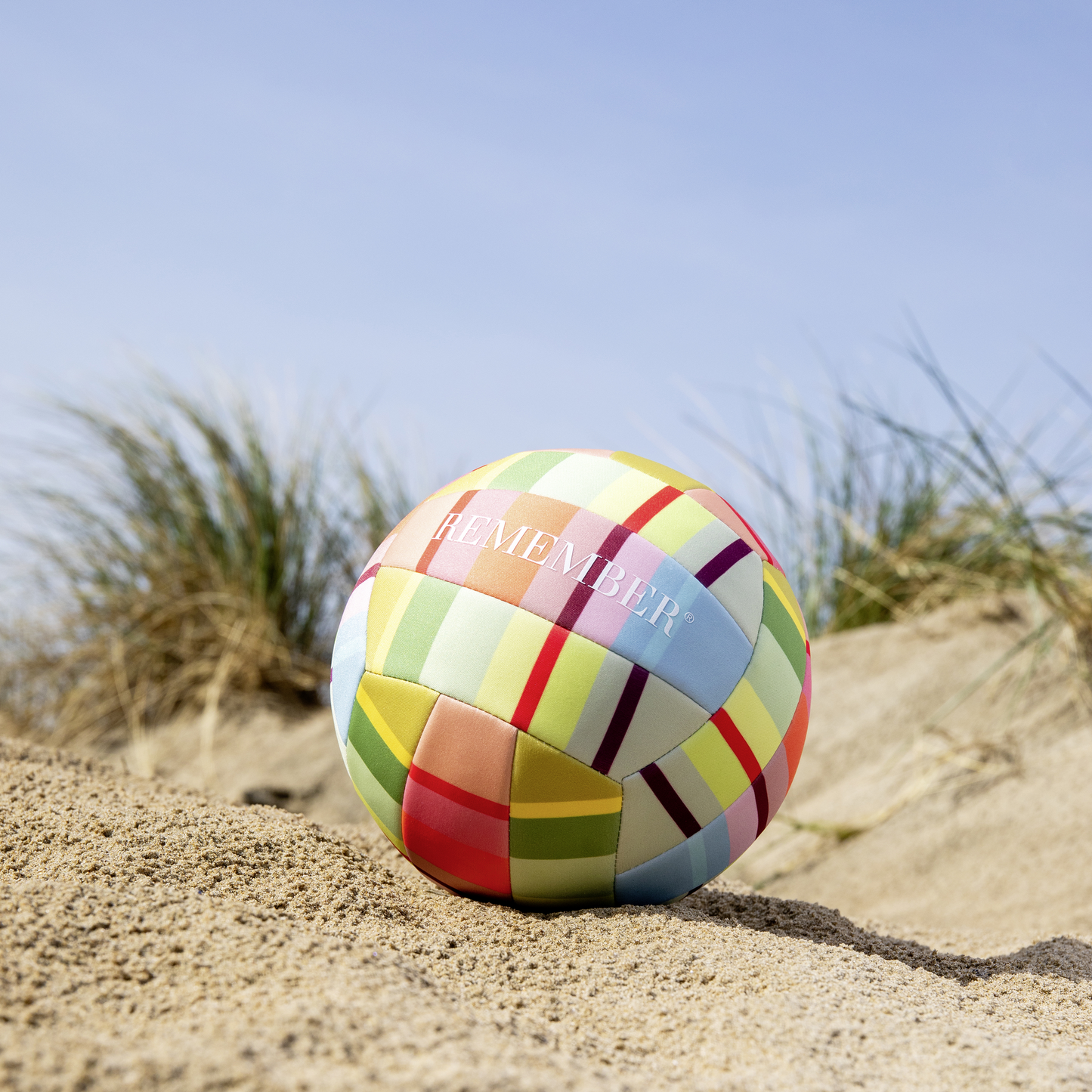 pastel colored volleyball at the beach