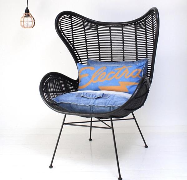 copper pendant light and black rattan egg chair