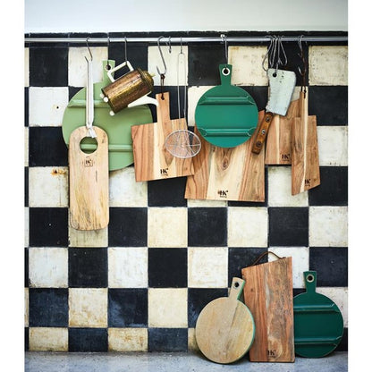 kitchen rack with different wooden cutting plates