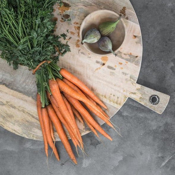 wooden cutting board with vintage look and carrots