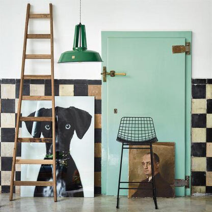 Green farm house door with old paintings and black metal wire bar stool by HK living
