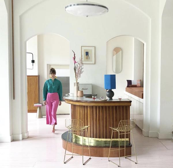 80's style living room with bar and brass metal wire bar stools by HK living