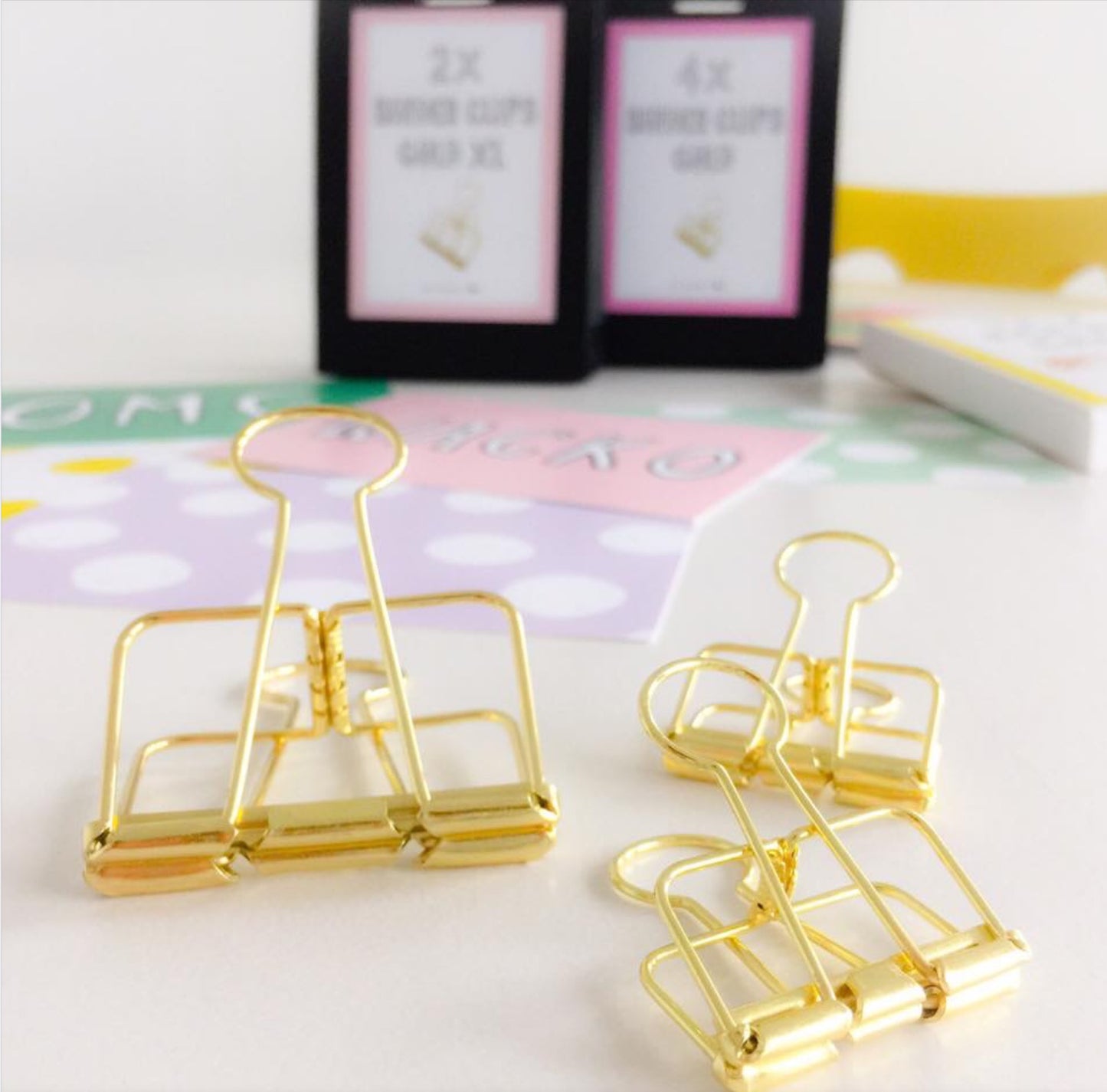 1 large and 2 medium size metal binders clips in gold 