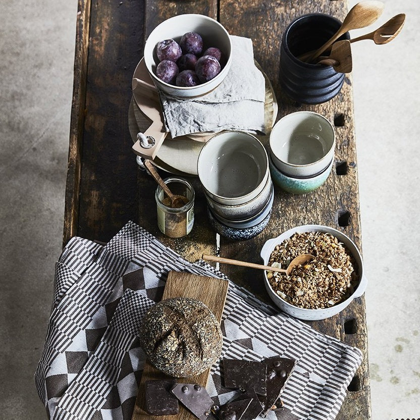 rustic table with wooden spoons and bread