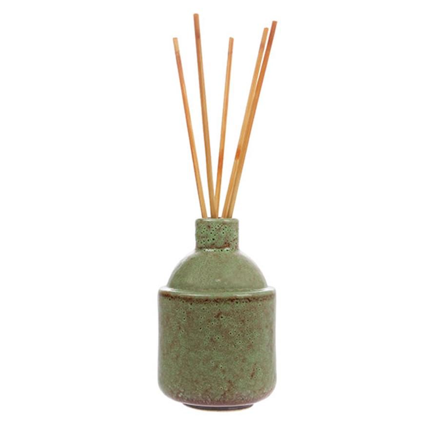 green ceramic pot with scented straws