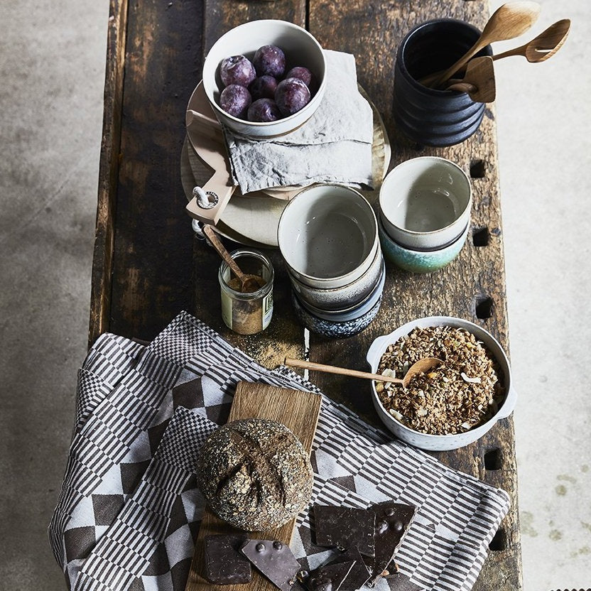 table with ceramics and wooden spoons