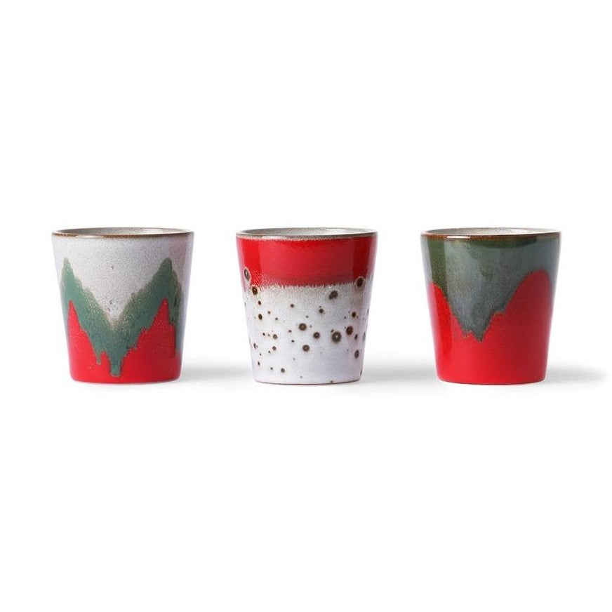 3 mugs in Christmas design with abstract green red white colors