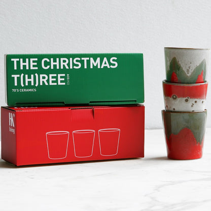3 Christmas coffee mugs in red and green and white colors with giftbox