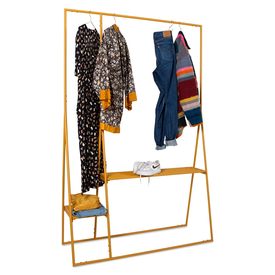 ginger orange open clothing display rack with sweaters and blouse and sneakers