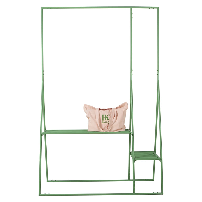 green clothing rack with pink tote with HKliving logo
