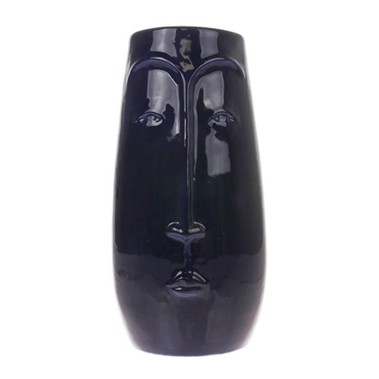dark blue vase with 3d face