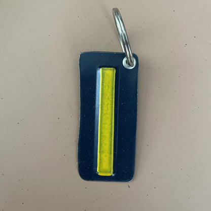 cut out i from recycled license plate turned into key chain