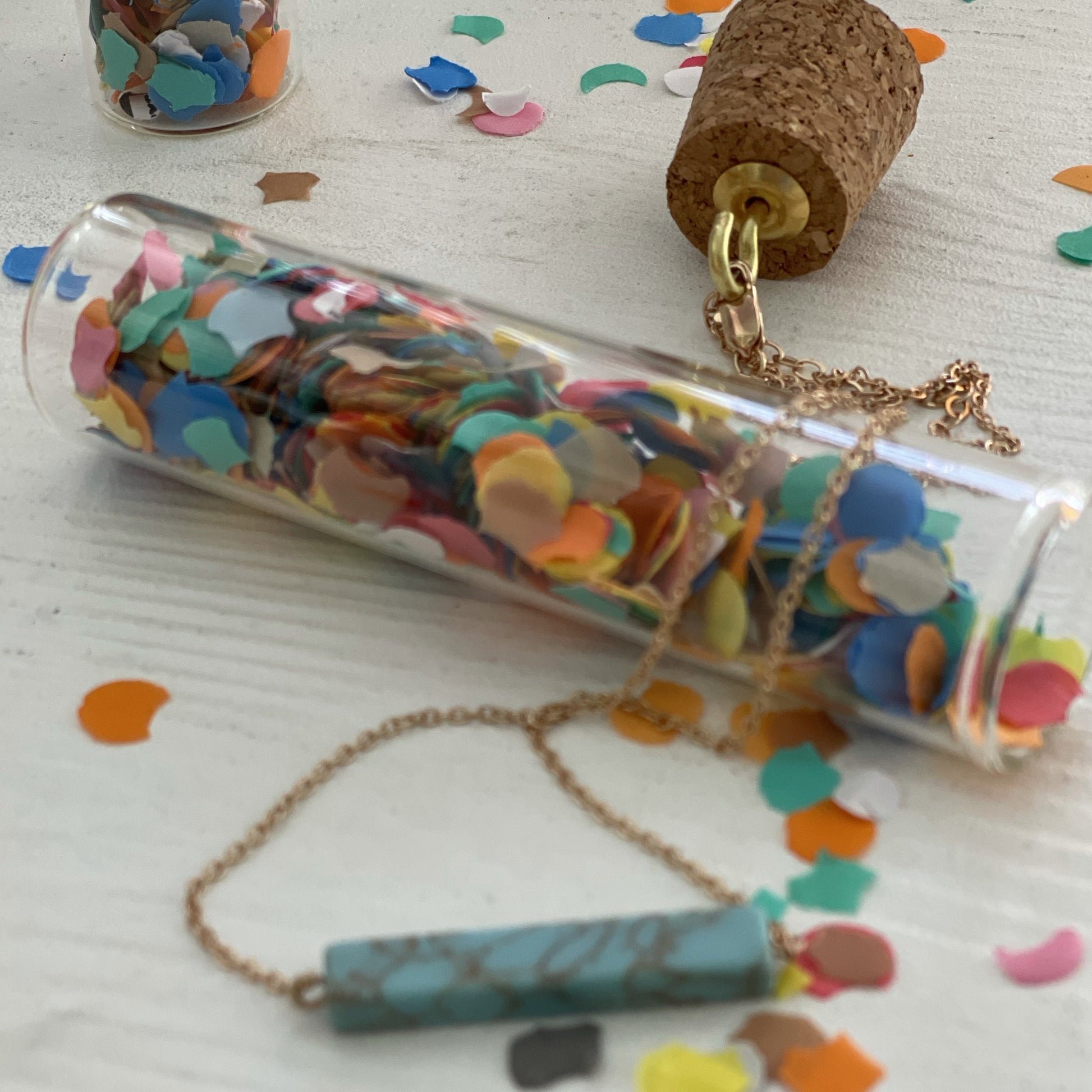 stone pendant necklace in glass tube with confetti