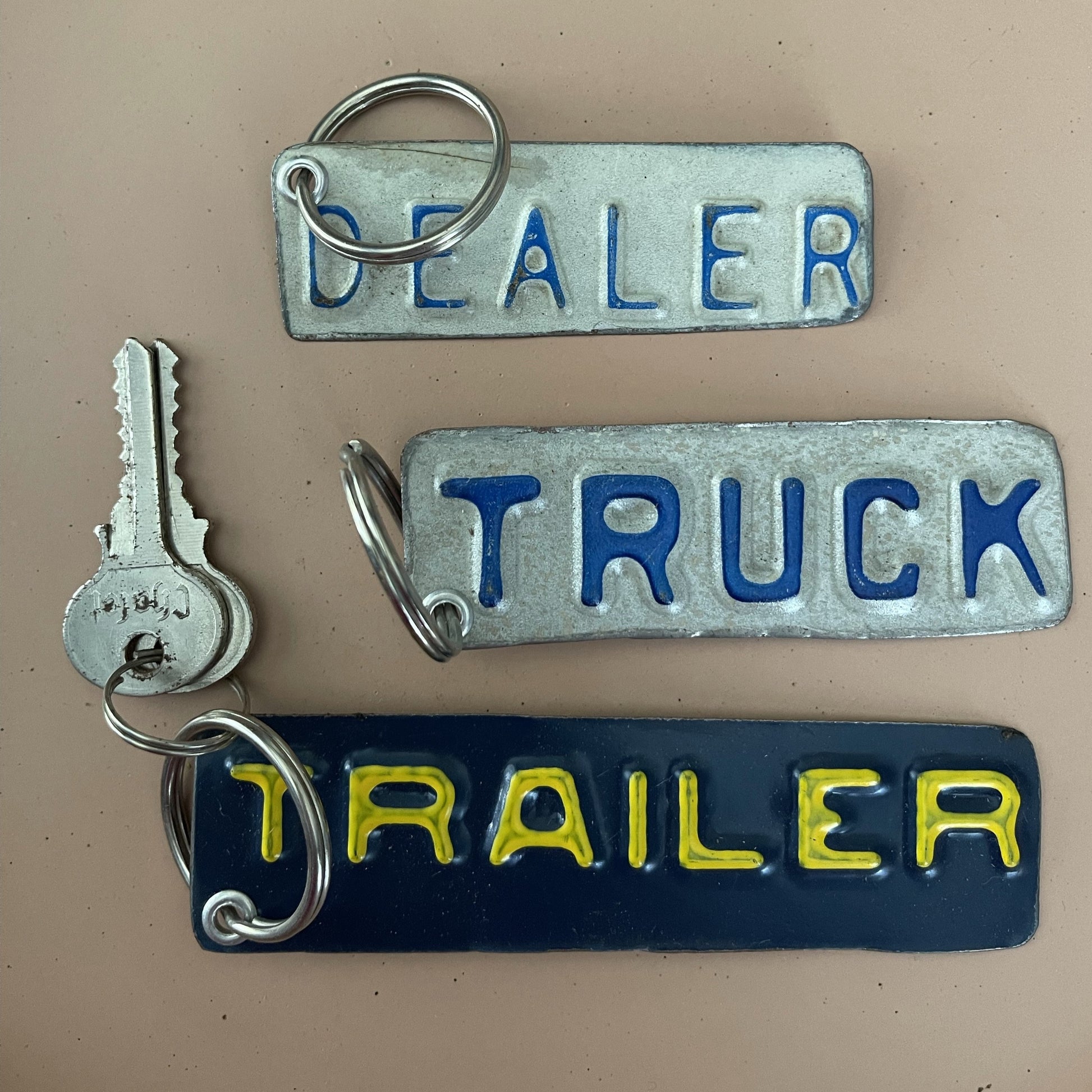 dealer, truck, trailer cut outs from license plate turned into key chains