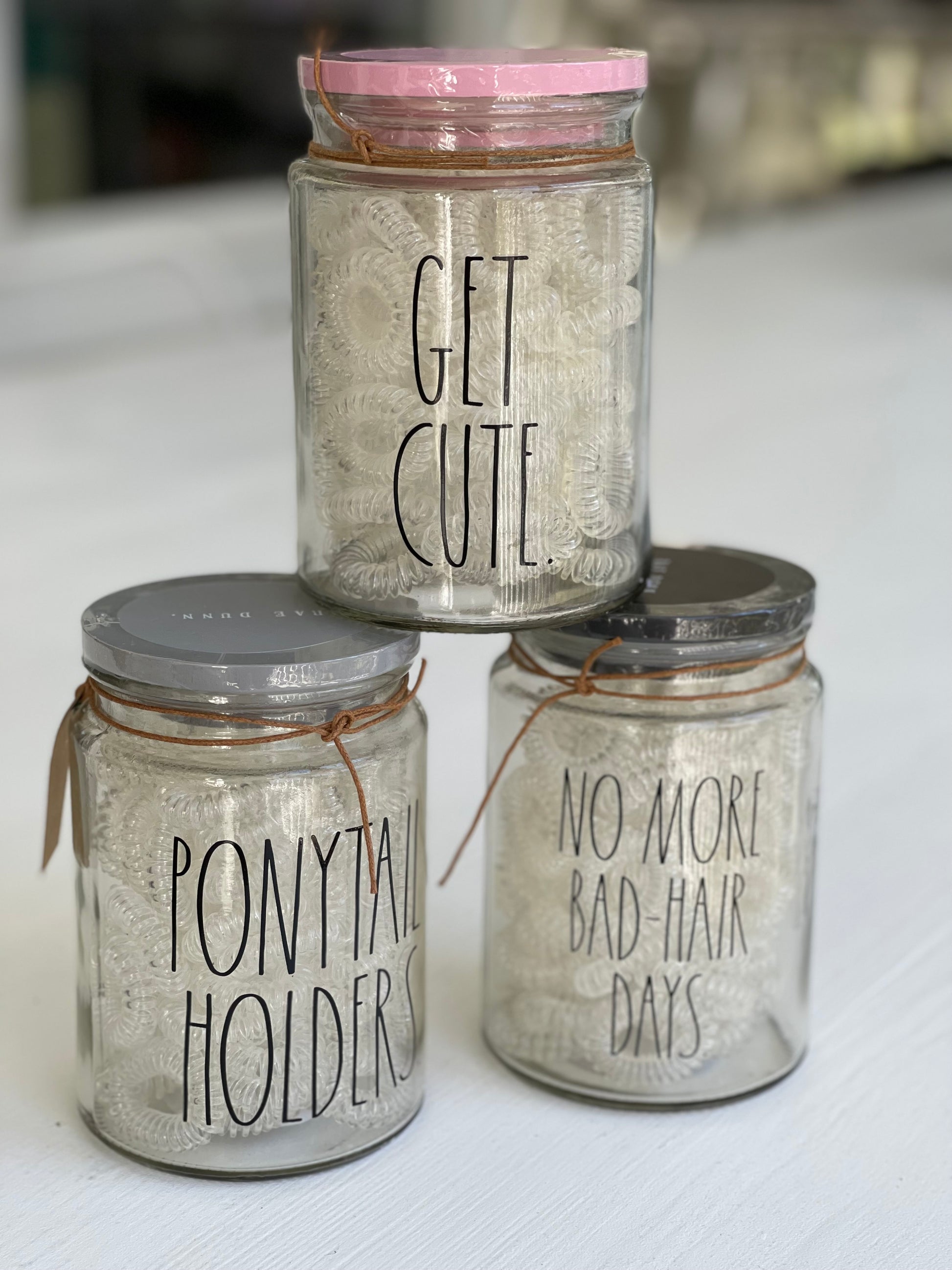 rae dunn glass jars with ponytail spiral holders