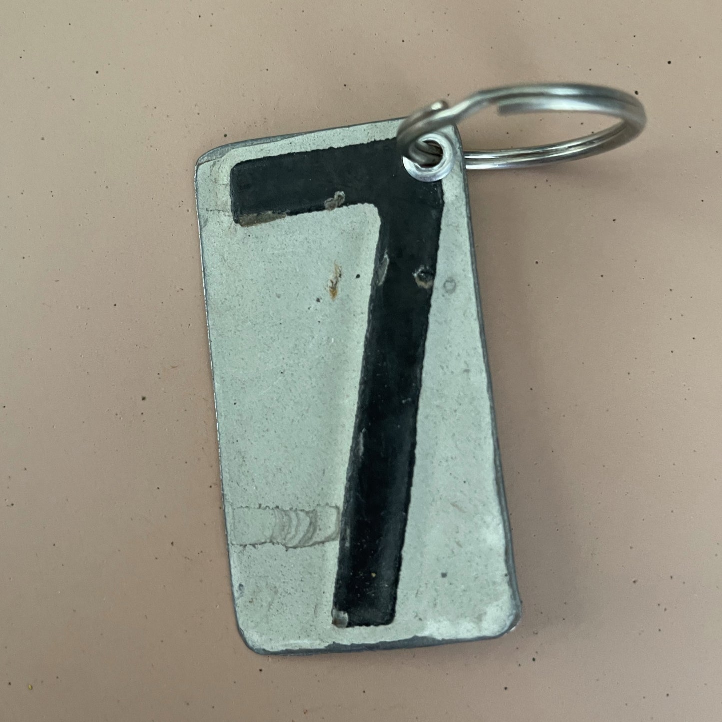 black number 7 keychain from recycled license plate