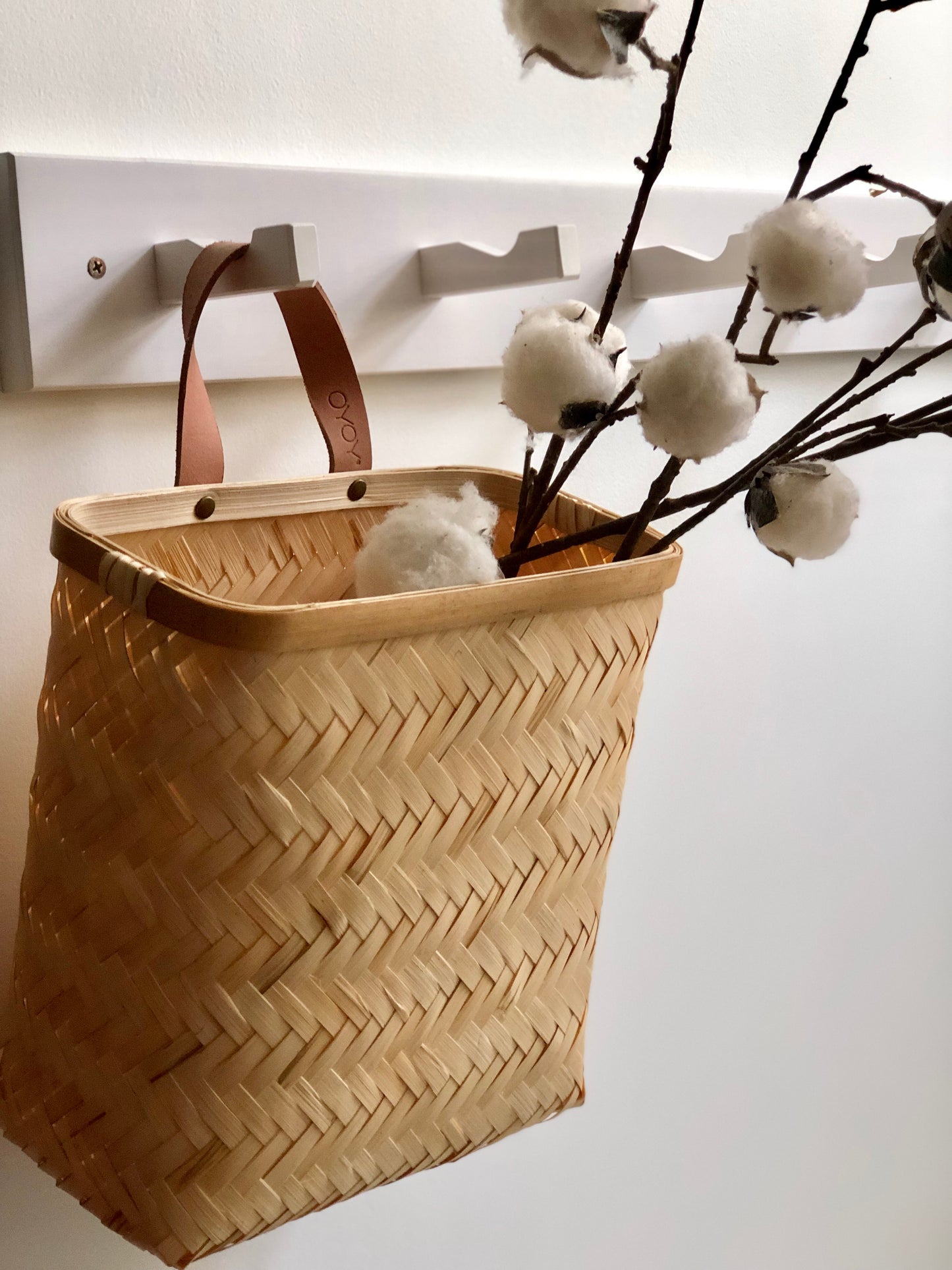bamboo wall basket  on white coat rack