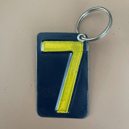 yellow  number 7 keychain from recycled license plate
