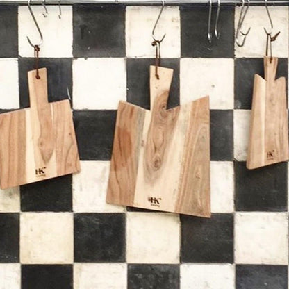 checkered back splash in black and white with wooden cutting boards