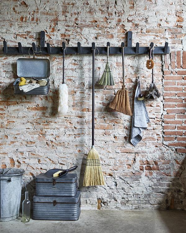 exposed brick wall with vintage brushes by hk living